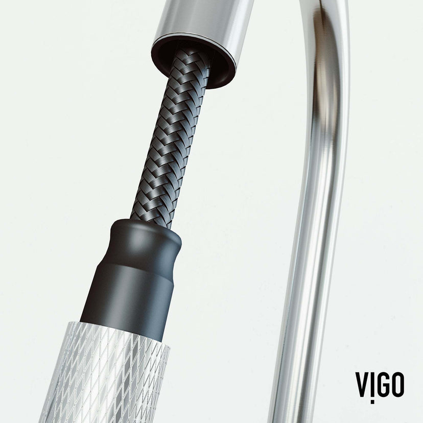 Spot-resistant stainless steel faucet with secure docking and pre-rinse