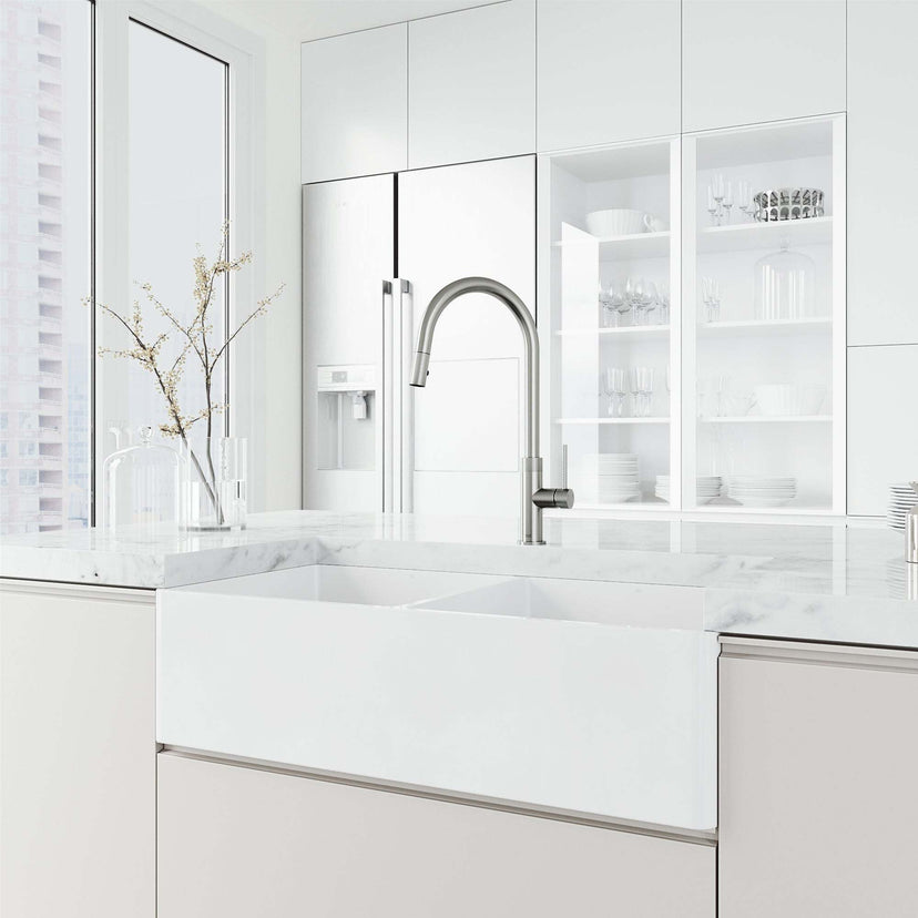 Brass kitchen faucet in stainless steel with included hose and sprayer