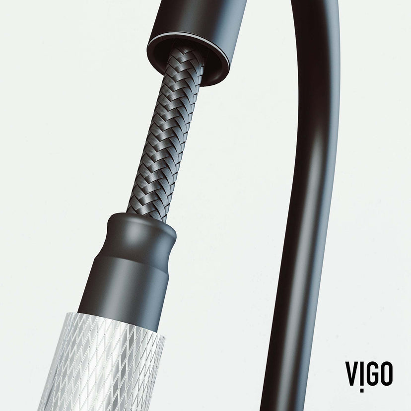 Spot-resistant black and steel faucet with secure docking and pre-rinse