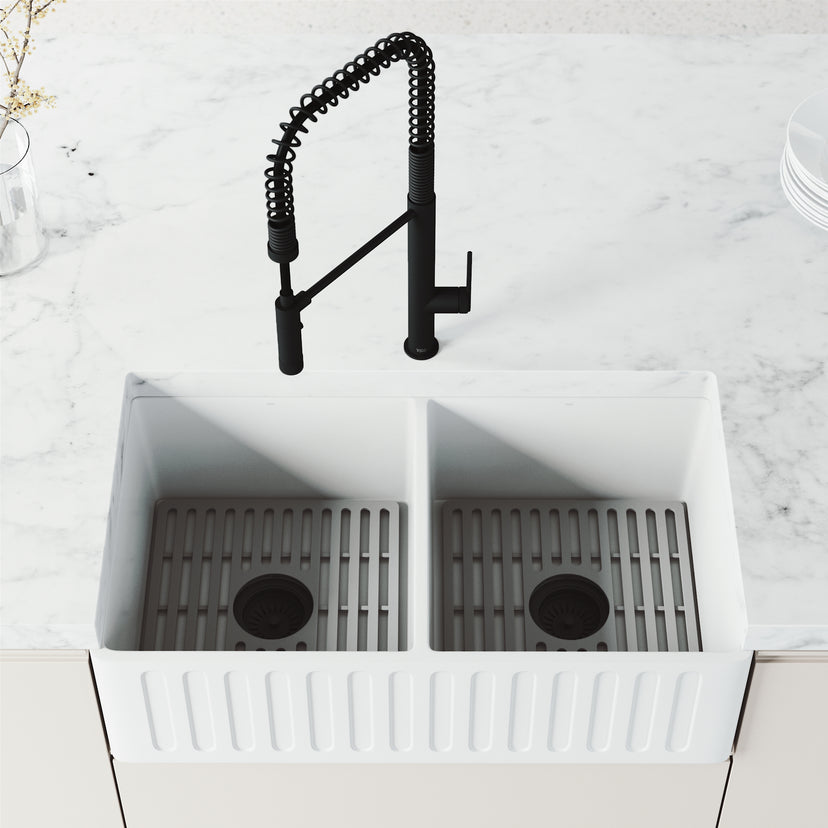 Pull-down kitchen faucet in matte black finish with secure docking station