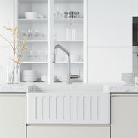 Deck-mounted kitchen faucet with included hose and sprayer head