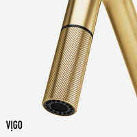 Matte brushed gold pull-down kitchen faucet with secure docking station and spot-resistant finish
