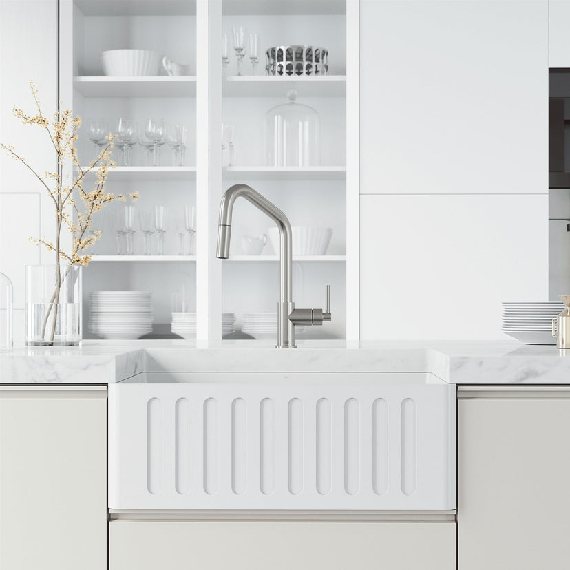 Deck-mounted kitchen faucet with included hose and sprayer head