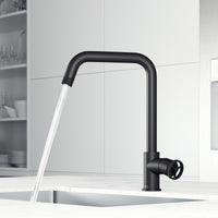 Modern deck-mounted kitchen faucet in matte black with lever handle and docking station