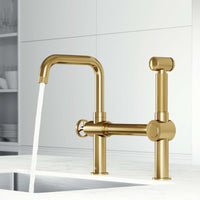 VIGO Cass kitchen faucet with pull-out side sprayer in chrome with exposed bridge design and wheel handle