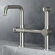 VIGO Cass kitchen faucet with sprayer in chrome finish featuring bridge design and pull-out side sprayer
