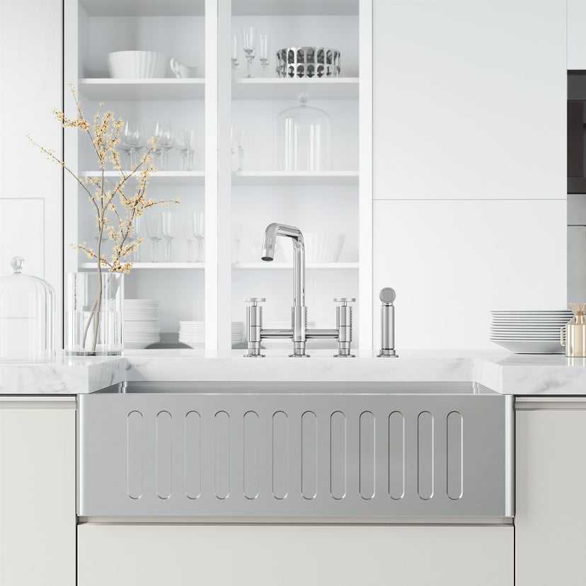 Deck mount kitchen faucet with included supply lines and sprayer head in chrome