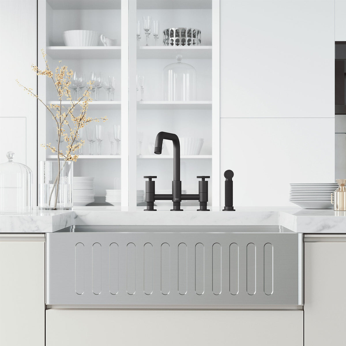 Deck mount kitchen faucet with included supply lines and sprayer head in matte black