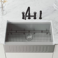 High-arc kitchen faucet with knob handles and side spray activation in matte black finish