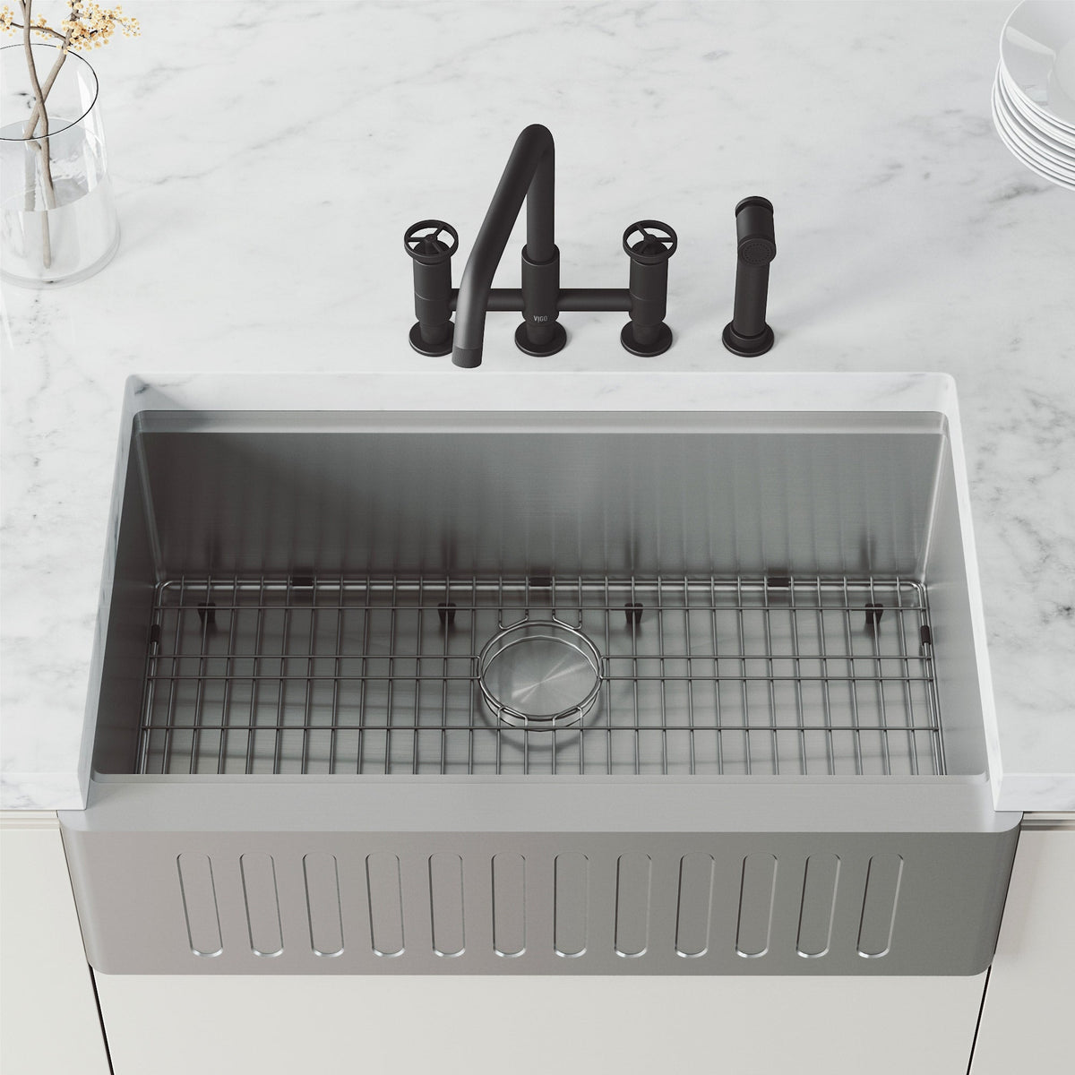 High-arc kitchen faucet with knob handles and side spray activation in matte black finish