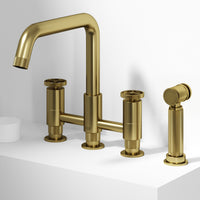 Matte brushed gold bridge faucet with side spray and compression fittings for deck mount