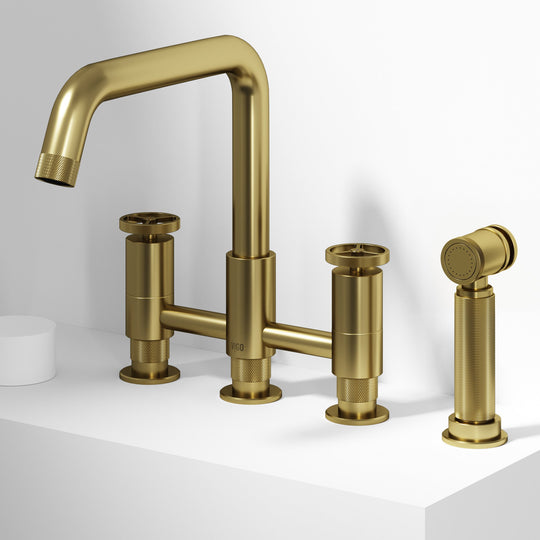Matte brushed gold bridge faucet with side spray and compression fittings for deck mount