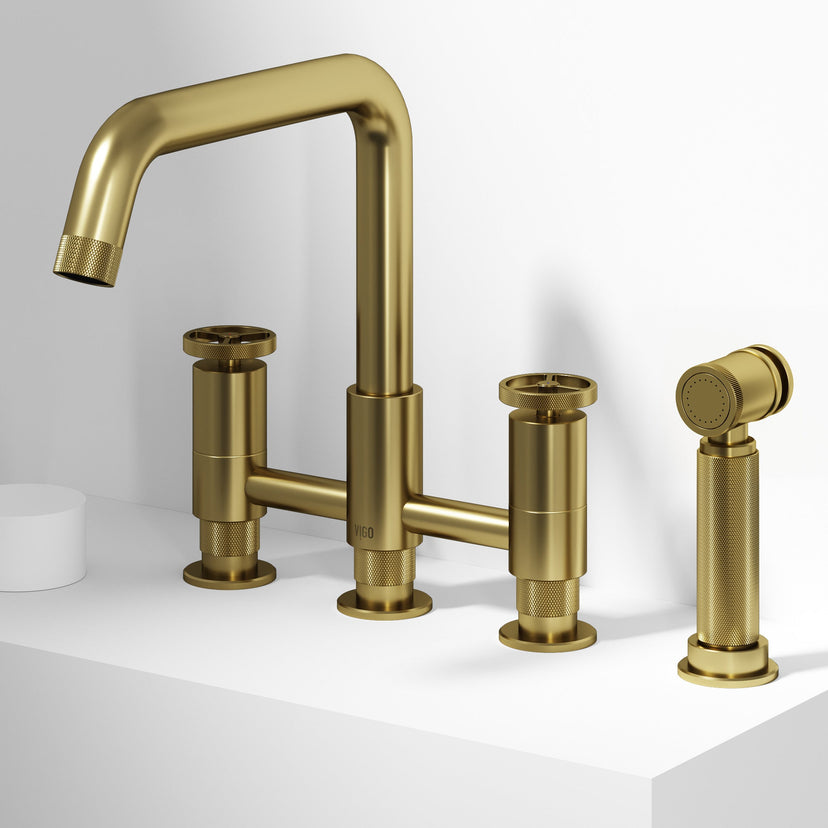 Matte brushed gold bridge faucet with side spray and compression fittings for deck mount