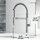 Chrome kitchen faucet featuring spot-resistant finish and secure docking sprayer station
