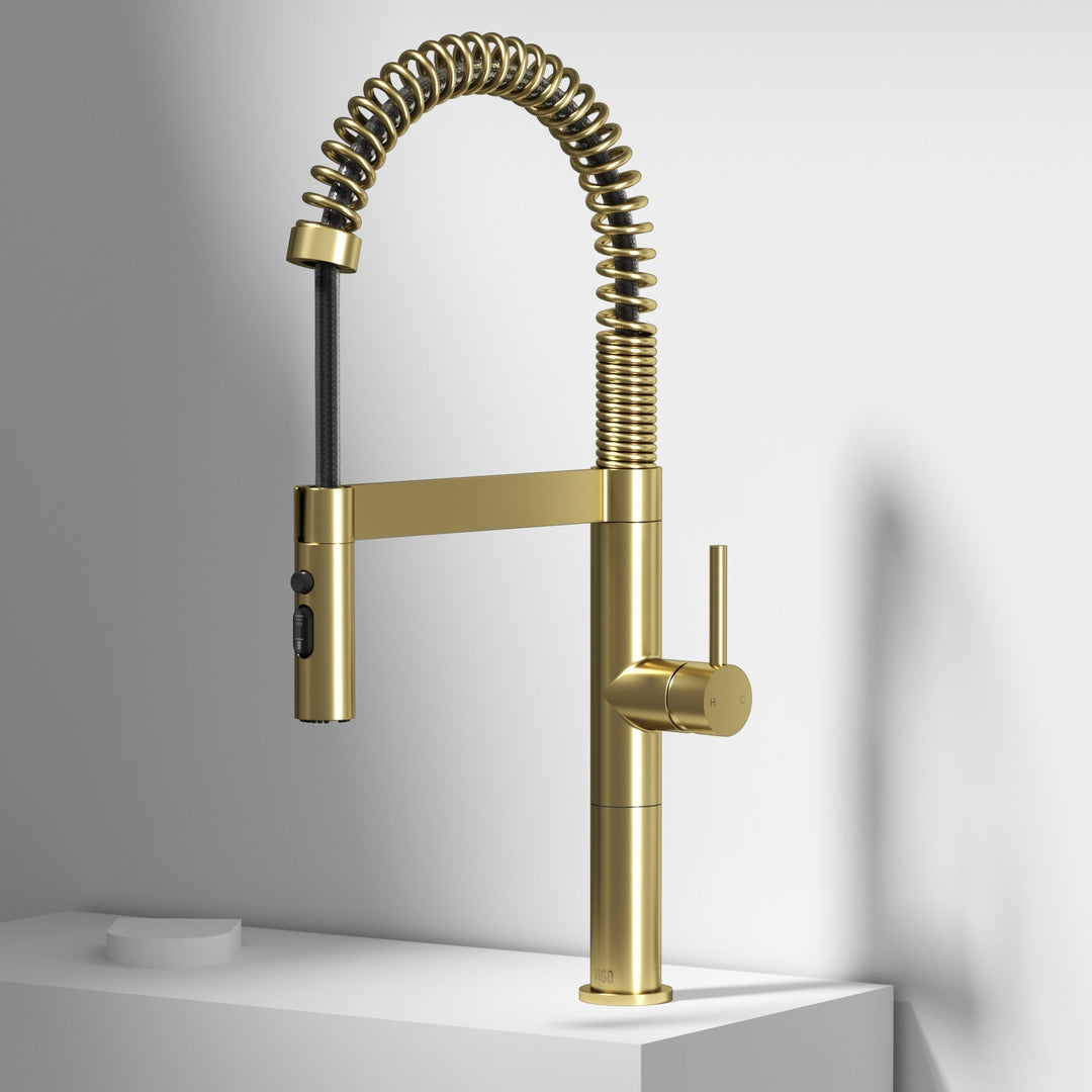 Modern kitchen faucet with high-arc spout and pull-down sprayer in matte gold