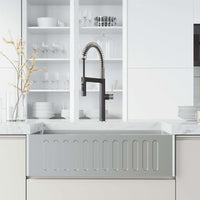 Edison Pro Pull-Down Spray Kitchen Faucet in stainless steel with matte black accents and flexible high-arc spring neck.