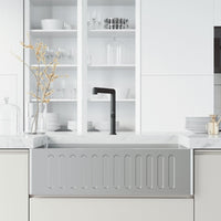 Kitchen faucet with sprayer docking station and lever handle in matte black
