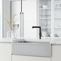 Matte black kitchen faucet with included hose and mounting materials