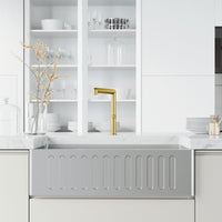 Kitchen faucet with sprayer docking station and lever handle in brushed gold
