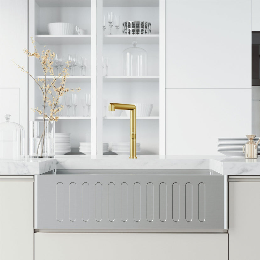 Kitchen faucet with sprayer docking station and lever handle in brushed gold