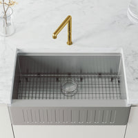 Deck-mounted brass faucet with gooseneck spout and 11-inch assembled height
