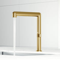 Modern deck-mounted kitchen bar faucet in matte brushed gold with swivel spout