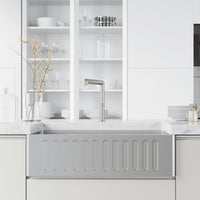 Kitchen faucet with sprayer docking station and lever handle in stainless steel