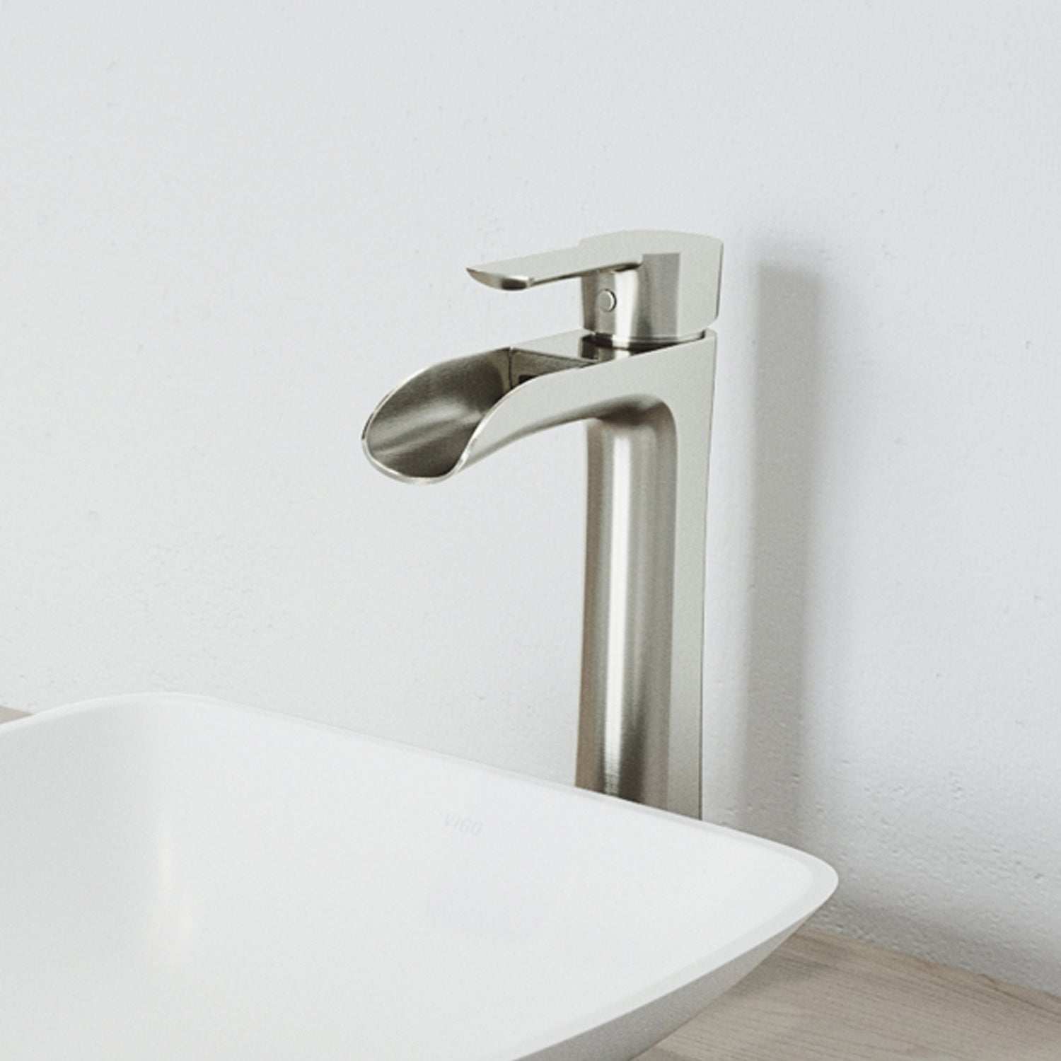 Brushed nickel vessel faucet with waterfall spout and lever handle