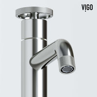 Brushed nickel faucet featuring knob handles and modern design