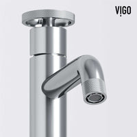 Chrome faucet featuring knob handles and modern design