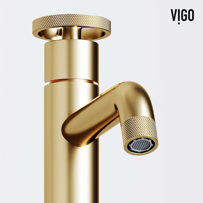 Matte brushed gold faucet featuring knob handles and modern design