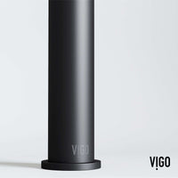 Deck-mounted vessel filler in matte black with included handles and supply lines