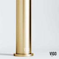 Deck-mounted vessel filler in matte brushed gold with included handles and supply lines