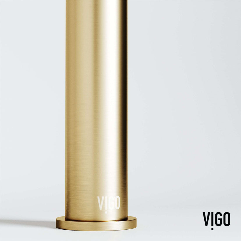 Deck-mounted vessel filler in matte brushed gold with included handles and supply lines