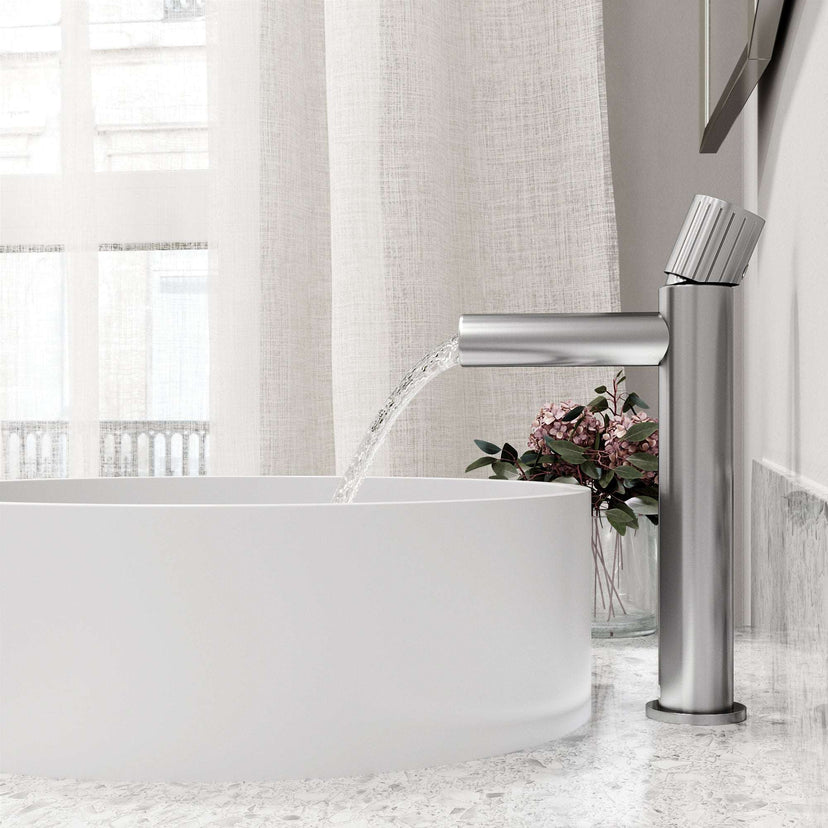 Brushed nickel faucet featuring lever handle and compression connection