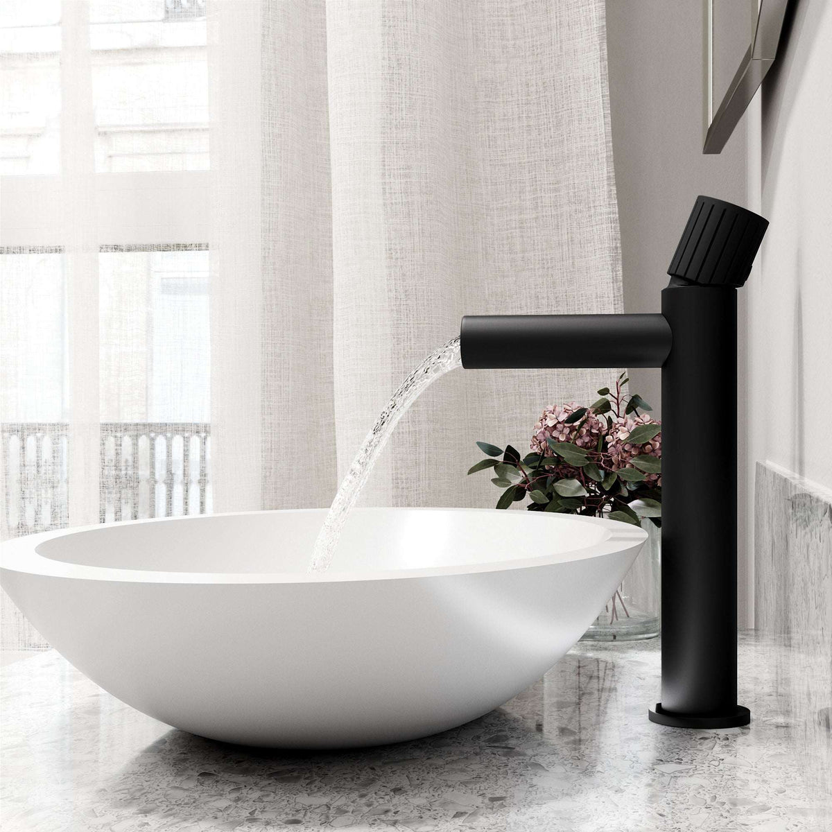 Matte black faucet featuring lever handle and compression connection