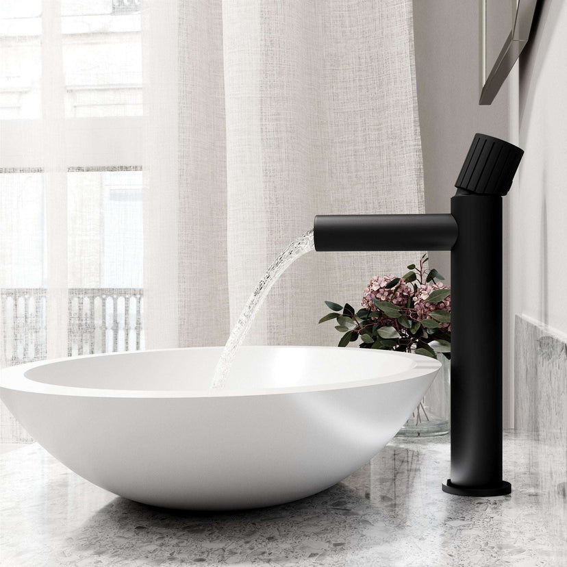 Matte black faucet featuring lever handle and compression connection