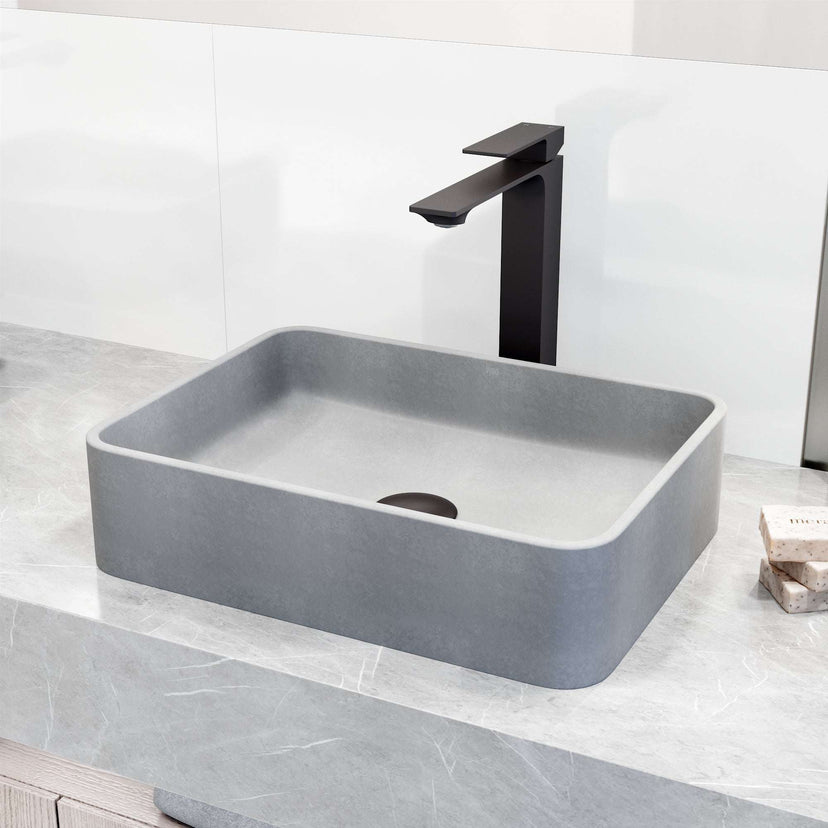 Matte black faucet featuring lever handle and low flow design