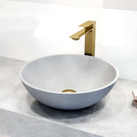 Matte brushed gold faucet featuring lever handle and low flow design