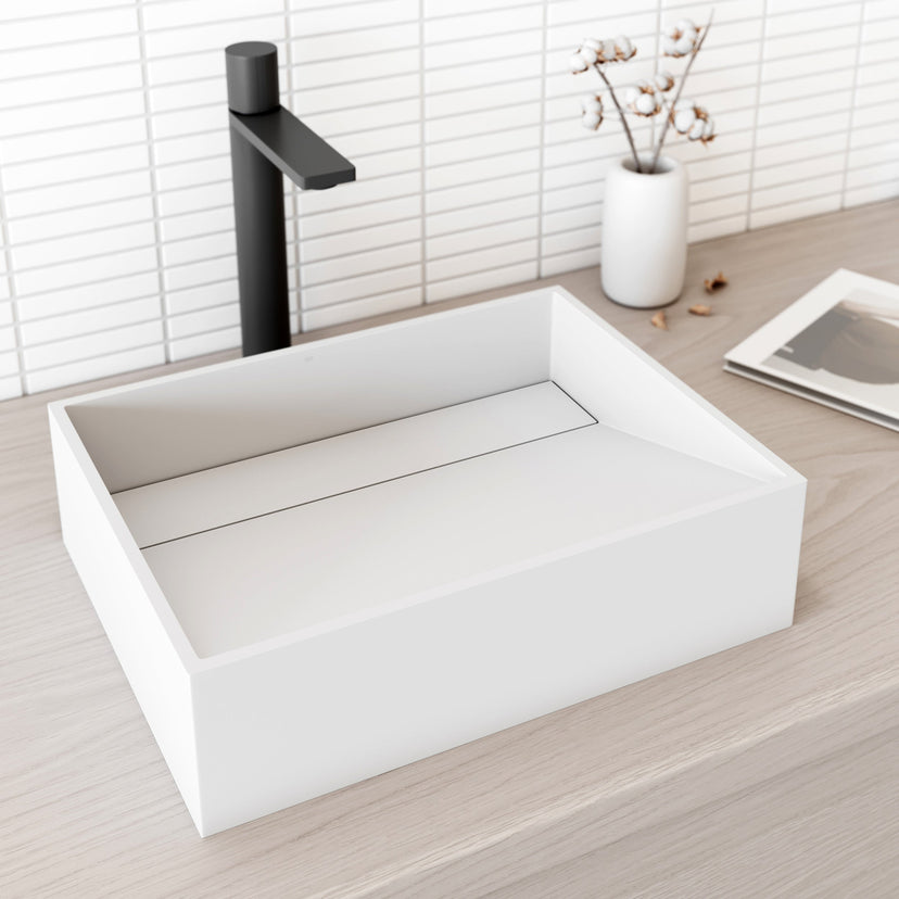 Rectangular matte white cast stone vessel sink with modern contemporary design