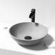 Gray concrete vessel sink with round shape and modern design