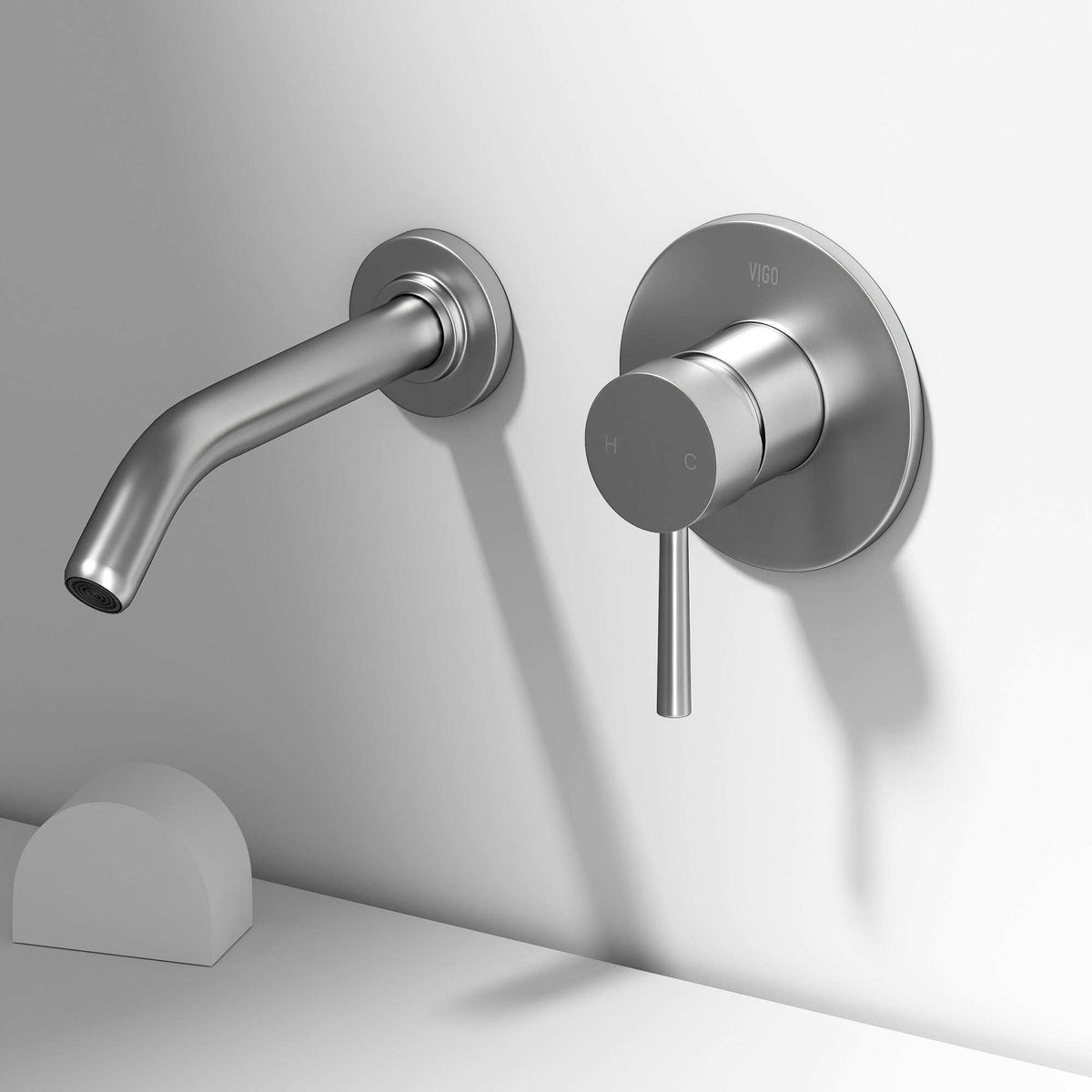 Brass wall faucet with low arc spout and included mounting materials