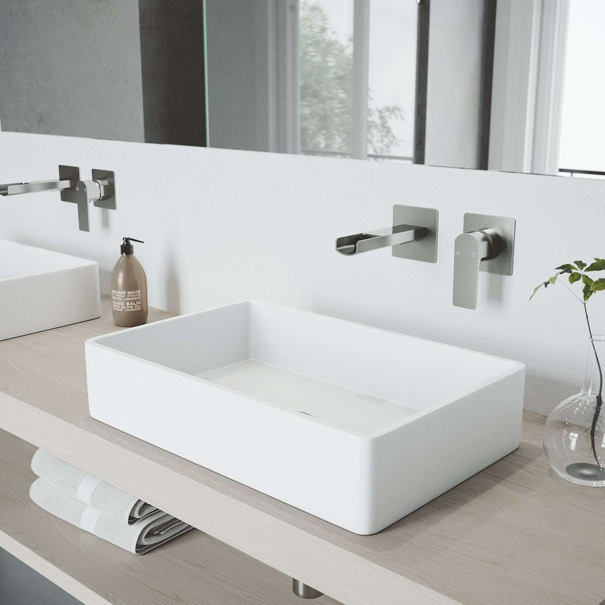 Sleek brushed nickel wall mount bathroom faucet with waterfall spout and single-lever control
