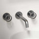 Brushed nickel wall mount bathroom faucet with low arc spout and knob handles