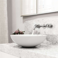 Brass cartridge wall mount faucet featuring hot/cold indicators and fingerprint resistant finish
