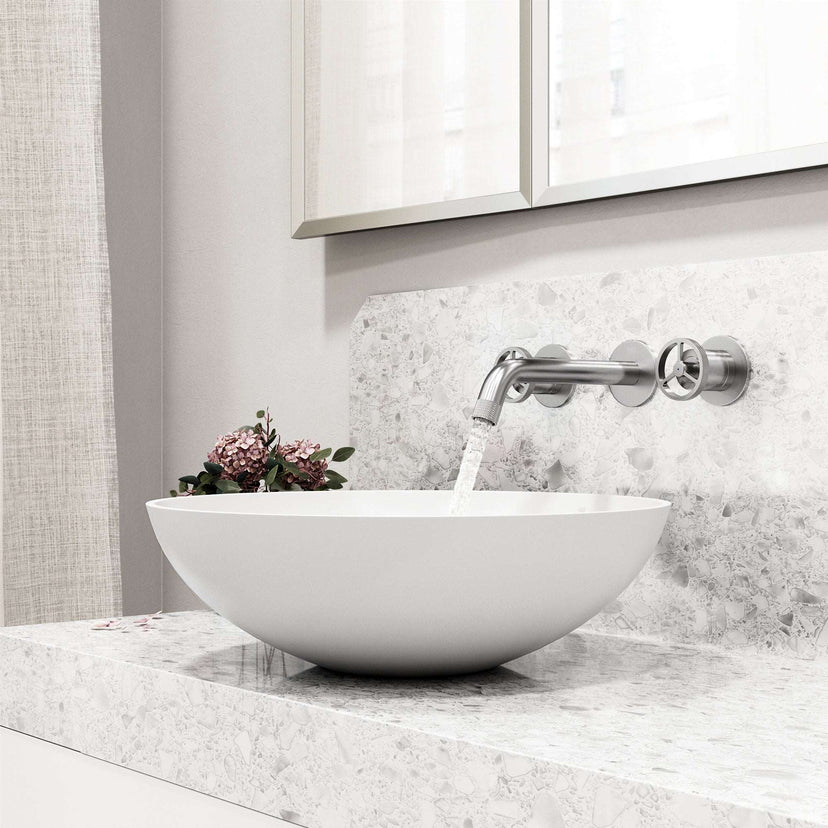 Brass cartridge wall mount faucet featuring hot/cold indicators and fingerprint resistant finish