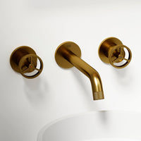 Matte brushed gold wall mount bathroom faucet with low arc spout and knob handles