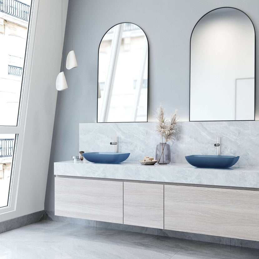 Glass vessel sink with modern design and royal blue color for bathrooms