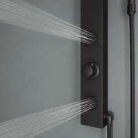 Stainless steel showerhead on matte black panel with flexible connection