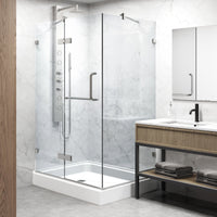 Frameless shower enclosure with included base and mounting hardware